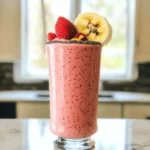 - 1 cup fresh or frozen strawberries - 1/2 cup rolled oats - 1 ripe banana, sliced - 1 cup almond milk (or any milk of your choice) - 1 tablespoon honey or maple syrup - 1 tablespoon chia seeds - 1/2 teaspoon vanilla extract - A pinch of salt The Strawberry Oatmeal Smoothie is not just tasty; it's also good for you. Here’s what you get from the main ingredients: - Strawberries: Packed with vitamin C, they help your immune system and skin. - Rolled Oats: They provide fiber, which is great for your digestion and keeps you full longer. - Banana: This fruit gives you potassium, which helps your heart and muscles. - Almond Milk: A low-calorie option, it’s great for those avoiding dairy. Each serving of this smoothie has about 200 calories. Here's a rough breakdown: - Carbohydrates: 40 grams - Protein: 5 grams - Fat: 4 grams - Fiber: 6 grams This smoothie is a balance of carbs, fiber, and some protein, making it a great start to your day or a refreshing snack. - The fiber from oats and bananas keeps you satisfied and helps digestion. - Strawberries are high in antioxidants, which can help reduce inflammation. - Adding chia seeds boosts your omega-3 fatty acids, good for heart health. - Honey or maple syrup can sweeten your drink without refined sugars. This Strawberry Oatmeal Smoothie is a healthy and wholesome treat that anyone can enjoy! - Rinse and hull fresh strawberries. This means washing them well and cutting off the green tops. - If you use frozen strawberries, you do not need to prepare them. Just toss them into the blender. - In a high-powered blender, combine the strawberries, rolled oats, sliced banana, and almond milk. - If you want it sweeter, add honey or maple syrup. This step is optional. - After blending, check the texture. If it is too thick, add a splash of almond milk. - Blend again until smooth. Adjust the thickness to your liking for the perfect drink. To boost the nutrients in your smoothie, consider adding a handful of spinach or kale. These greens blend well and add vitamins without changing the taste much. You can also try adding a spoonful of nut butter for healthy fats. Another great option is to toss in some flaxseeds for extra fiber. For flavor variations, mix in some pineapple or mango. These fruits add a tropical twist. If you like a bit of spice, try adding a sprinkle of cinnamon or nutmeg. These spices enhance the sweetness without extra sugar. Garnishing your smoothie can make it look more appealing. Top it with whole strawberries or a light sprinkle of chia seeds. You can also add a slice of banana on the rim of your glass. This not only looks nice but adds to the flavor too. The best times to enjoy your smoothie are breakfast or as a snack. It’s quick to make and fills you up. You can even have it after a workout for a nice energy boost. Sometimes, your smoothie may be too thick. If this happens, add more almond milk slowly until you reach your desired texture. You can also blend it longer for a smoother mix. If you find it too runny, add more rolled oats or a banana. These ingredients can help thicken it up while keeping the flavor good. Enjoy experimenting until you find your perfect blend! {{image_4}} You can easily switch ingredients to fit your needs. If you want a dairy-free option, use non-dairy milk. Choices include almond milk, coconut milk, or oat milk. Each brings its own unique flavor. If you need gluten-free options, use gluten-free oats. These will work just as well as regular rolled oats. You can also try quinoa flakes or ground flaxseed for a different texture. To shake things up, consider adding cocoa powder or nut butter. Cocoa powder gives a rich chocolate twist, while nut butter adds creaminess and protein. Almond butter or peanut butter can enhance your smoothie further. Mixing in other fruits can create fun new flavors. Try bananas, blueberries, or peaches. Each fruit brings a fresh taste that pairs well with strawberries. Seasonal fruits can add variety to your smoothie. In summer, mix in peaches or watermelon. These fruits keep your smoothie light and refreshing. In winter, consider hearty flavors like pumpkin or apple. You can also add spices like cinnamon or nutmeg for warmth. This way, your smoothie stays tasty all year round. To keep your leftover smoothie fresh, store it in an airtight container. This helps prevent oxidation. Use glass jars or plastic containers with lids. Just make sure they seal tightly. If you can, drink your smoothie within 24 hours for the best taste. If you plan to enjoy it later, store it in the fridge. If you want to make smoothies ahead, freezing is a great option. To freeze your smoothie, pour it into ice cube trays or freezer-safe bags. This way, you can grab what you need. When you’re ready to drink it, thaw in the fridge overnight. You can also blend it frozen for a thicker treat. Fresh strawberries last about three to seven days in the fridge. Keep them dry to extend their life. Bananas stay good for about two to seven days, depending on ripeness. For rolled oats, store in a cool, dry place. They can last for months. Chia seeds can last up to two years if kept in a sealed container. Always check for freshness before using! To make this smoothie vegan, swap out dairy milk for almond milk or any nut milk. You can also replace honey with maple syrup or agave syrup for sweetness. Both options keep the flavor great and ensure the smoothie stays plant-based. Yes, you can replace oats! For a gluten-free version, use gluten-free oats or ground flaxseed. If you want a low-carb option, try using unsweetened coconut flour or a banana instead. These swaps can adjust the texture and flavor while keeping it delicious. Oats are full of fiber, which helps you feel full and supports digestion. They also provide energy and can lower cholesterol levels. Adding oats to your smoothie boosts its nutritional value and helps keep your heart healthy. To thicken your smoothie without extra calories, try adding more oats or a banana. You can also use less almond milk. Another trick is to freeze your fruits before blending. This gives the smoothie a creamy texture while keeping it healthy. This blog post shared how to make a simple and tasty Strawberry Oatmeal Smoothie. You learned about tasty ingredients, steps to prepare, and fun tips to enhance flavor. We also discussed storage options and answered common questions. Smoothies are a great way to start your day or refuel. With endless variations and easy swaps, you can make this smoothie your own. Enjoy your healthy drink, and feel free to be creative with flavors and toppings!