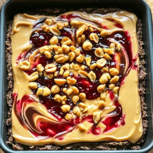 To make these bars, you'll need some key ingredients. Each one plays a big role in flavor and texture. Gather the following: - 1 cup graham cracker crumbs - 1/2 cup unsweetened cocoa powder - 1/3 cup melted coconut oil - 2 cups cream cheese, softened - 1 cup creamy peanut butter - 1/2 cup powdered sugar - 1 teaspoon vanilla extract - 1 cup mixed berry jam (raspberry or strawberry works beautifully) - 1/4 cup crushed peanuts (for garnish) These ingredients work together to create a creamy, rich, and delicious bar that everyone will love. The graham cracker crumbs and cocoa powder create a tasty crust. The mix of cream cheese and peanut butter gives the cheesecake layer a smooth texture. While the bars are great as is, you can add some fun toppings! Here are a few ideas: - Fresh berries (strawberries, raspberries, or blueberries) - Whipped cream for a fluffy touch - A drizzle of chocolate sauce for extra sweetness - More crushed peanuts for added crunch These toppings can make your dessert even more appealing. Feel free to mix and match to suit your taste. Knowing what you eat is important. Each serving has: - Calories: 250 - Total Fat: 18g - Saturated Fat: 8g - Cholesterol: 30mg - Sodium: 150mg - Total Carbohydrates: 20g - Dietary Fiber: 2g - Sugars: 10g - Protein: 4g This dessert is rich and satisfying. Enjoy it in moderation as a sweet treat! Start with a medium bowl. Add 1 cup of graham cracker crumbs and 1/2 cup of cocoa powder. Mix them well. This mix gives a rich flavor to the crust. Now, pour in 1/3 cup of melted coconut oil. Stir it until it looks like damp sand. Next, grab an 8x8 inch baking pan and grease it lightly. Pour the crumb mix into the pan. Press it down with a measuring cup. Make sure it is compact and even. This step is key for a good base. In another large bowl, add 2 cups of softened cream cheese. Then, mix in 1 cup of creamy peanut butter. Add 1/2 cup of powdered sugar and 1 teaspoon of vanilla extract. Use an electric mixer to blend this mix. Beat it until it is smooth and creamy. There should be no lumps left. Once smooth, gently spread this peanut butter mixture over the crust. Use a spatula to make the top flat and even. This layer adds a rich taste that pairs well with the jam. Now, take 1 cup of mixed berry jam. You can use raspberry or strawberry jam for great flavor. Dollop the jam over the peanut butter layer. Then, take a knife or toothpick and swirl it gently. This creates a lovely marbled look. Try to spread the jam evenly for the best taste. Once done, cover the pan with plastic wrap and place it in the fridge. Refrigerate for at least 4 hours, but overnight is best. This waiting time helps the bars set up nicely. When making no-bake peanut butter jelly cheesecake bars, it's easy to make mistakes. Here are some tips to avoid them: - Not measuring ingredients: Always measure your ingredients. This helps keep the right balance. - Skipping the chilling time: Don't rush! These bars need time to set. Chill for at least four hours. - Using cold cream cheese: Make sure the cream cheese is softened. Cold cream cheese makes mixing hard. - Overmixing the filling: Mix until smooth, but don't overdo it. Overmixing can add air and change texture. To get that creamy texture you want, follow these steps: - Soften the cream cheese: Let it sit at room temperature for 30 minutes. This makes it easier to mix. - Use an electric mixer: This helps blend the peanut butter well with the cream cheese. Aim for a smooth consistency. - Don't skip the coconut oil: This adds creaminess and helps the bars hold together. - Press the crust firmly: Make sure your graham cracker crust is compact. This keeps it from crumbling when you cut it. How you present your bars can make a big difference. Here are some ideas: - Serve chilled on a nice platter: A colorful plate makes the bars look even better. - Add fresh berries: Place some fresh berries next to the bars. This adds color and freshness. - Sprinkle crushed peanuts: Just before serving, add crushed peanuts on top. This gives a nice crunch and style. - Cut into even squares: Use a sharp knife to cut neat squares or rectangles. This makes them easy to serve. Try these tips for a perfect experience with your no-bake peanut butter jelly cheesecake bars! {{image_4}} You can switch up the jam for a new taste. Try raspberry, strawberry, or even blueberry jam. Each jam brings its own flavor. If you want a nutty twist, swap peanut butter for almond or cashew butter. These swaps make the bars unique and fun. You can even mix jams for a fruity surprise. If you need a gluten-free option, use gluten-free graham crackers. Crush them just like regular ones. You can also use oats or almond flour. Mix these with cocoa powder and coconut oil, just like the original. This way, everyone can enjoy the bars without worry. For a vegan version, substitute cream cheese with a nut-based cream cheese. Look for brands made from cashews or almonds. Use maple syrup instead of powdered sugar for sweetness. You can also select a plant-based butter or coconut cream. These changes keep the bars creamy and delicious without dairy. To keep your no-bake peanut butter jelly cheesecake bars fresh, store them in the fridge. Place the bars in an airtight container. This will help prevent them from drying out. Make sure to keep them covered with plastic wrap or a lid. This keeps the flavors locked in and the texture just right. These cheesecake bars can last up to one week in the fridge. If you store them properly, they stay yummy. Check for any signs of spoilage before you eat them. If they look or smell off, it's best to toss them. If you want to keep them longer, you can freeze the bars. First, cut them into squares. Wrap each piece in plastic wrap, then place them in a freezer-safe bag. They can last up to three months in the freezer. When you're ready to eat, thaw them in the fridge overnight. This way, they stay creamy and delicious. Yes, you can use other crusts. Graham cracker crumbs work well, but you can try crushed cookies like Oreos or vanilla wafers. If you need a gluten-free option, use gluten-free graham crackers or almond flour. Just mix with melted coconut oil as in the recipe. Press it firmly into the pan for a good base. If you can’t find mixed berry jam, no worries! Raspberry or strawberry jam works just as well. You can also blend your favorite berries with a bit of sugar to make your own jam. This way, you can customize the flavor to your liking. You can make these bars healthier by using low-fat cream cheese. You can also swap out the powdered sugar for a natural sweetener like honey or maple syrup. If you want to cut down on calories, use less peanut butter or a nut butter alternative. Adding some chia seeds or flaxseeds can boost the nutrition too! You learned how to make delicious no-bake peanut butter jelly cheesecake bars. We covered the must-have ingredients, detailed instructions, and tips for perfect results. I shared ways to add variety and adjusted the recipe for special diets. With the right storage, these bars stay fresh and tasty. Remember, cooking should be fun. Experiment and find what you love. Enjoy your tasty creation!