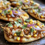 To make BBQ chicken flatbread pizza, you need these items: - 2 flatbreads (store-bought or homemade) - 1 cup cooked chicken, shredded - 1/2 cup of your favorite BBQ sauce - 1 cup shredded mozzarella cheese - 1/2 cup red onion, thinly sliced - 1/2 cup corn kernels (canned or thawed frozen) - 1/4 cup fresh cilantro, chopped - 1/4 teaspoon smoked paprika - Olive oil for brushing - Salt and pepper to taste Fresh ingredients matter. They add flavor and make your dish taste better. Fresh herbs, like cilantro, give a pop of color and a burst of taste. Fresh chicken will add juiciness. Using fresh vegetables, like red onions and corn, gives you texture and sweetness. When you use fresh items, you create a better meal. Sometimes you run out of an ingredient. No worries! You can swap items easily. - If you don’t have flatbreads, use pita or tortillas. - For BBQ sauce, try buffalo sauce or a homemade sauce. - Instead of mozzarella, use cheddar or gouda for a different taste. - If you need a veggie option, skip the chicken and add more veggies. - You can replace corn with bell peppers or mushrooms for a new twist. These swaps can help you make a tasty pizza no matter what you have on hand. First, preheat your oven to 425°F (220°C). This helps the pizza bake evenly and turn crispy. Next, grab a medium bowl. Add the shredded chicken and BBQ sauce. Mix until the chicken is fully coated. This adds great flavor to the chicken. Now, take your flatbreads. Place them on a baking sheet lined with parchment paper. This keeps them from sticking. Lightly brush the tops of the flatbreads with olive oil. This will help them crisp up nicely. Now for the fun part! Spread the BBQ chicken mix evenly over the flatbreads. Make sure to cover them well. Then, sprinkle a generous amount of mozzarella cheese on top. This cheese melts beautifully and adds a creamy texture. Next, add the sliced red onion and corn. These toppings give extra sweetness and crunch. Don’t forget to sprinkle some smoked paprika, salt, and pepper. This adds depth to the flavor. Place the baking sheet in the oven and bake for 12-15 minutes. Keep an eye on them. You want the cheese to be bubbly and the edges golden brown. Once the pizza is done, take it out of the oven. Let it cool for a few minutes. This makes slicing easier. Before serving, add freshly chopped cilantro on top. This adds a pop of color and fresh taste. Now, slice the flatbreads into pieces. Serve them on a wooden cutting board for a nice touch. Drizzle extra BBQ sauce on top if you like. Enjoy your delicious BBQ chicken flatbread pizza! To get a great crust, start with good flatbreads. You can use store-bought or make your own. Brush olive oil on top before baking. This helps create a crispy texture. Make sure your oven is hot. Preheat it to 425°F (220°C). The high heat cooks the flatbread fast and evenly. Bake it for about 12-15 minutes. Watch for a golden brown edge. This is your sign that it’s ready. Adding flavor is key. Use your favorite BBQ sauce, but don’t stop there. Smoke paprika brings a nice depth. It adds warmth and a little zing. Fresh cilantro adds brightness. Always sprinkle it on top before serving. For a touch of sweetness, add corn. It complements the BBQ sauce well. You can also use different cheeses. Try cheddar or gouda for a twist. Each option brings its own unique taste. One mistake is overloading the toppings. Too many toppings can lead to sogginess. Keep it simple with just a few key ingredients. Another mistake is not preheating the oven. If the oven isn’t hot enough, your crust won’t cook well. Also, don’t forget to slice the flatbread after it cools. This makes for easier serving and better presentation. Lastly, always taste your BBQ sauce. Adjust the seasoning to suit your taste buds. {{image_4}} You can make a tasty BBQ flatbread pizza without meat. Replace the chicken with roasted veggies. Bell peppers, mushrooms, and zucchini work great. They add flavor and color. Use the same BBQ sauce to keep the taste bold. You can also add black beans for protein. Top with cheese, and bake as usual. While BBQ sauce shines here, feel free to experiment. Try ranch dressing for a creamy twist. A spicy buffalo sauce can add heat. For cheese, mozzarella is classic, but you can switch it up. Cheddar or gouda can give a new flavor. Vegan cheese is a great choice for dairy-free options. Toppings can make your flatbread unique. Consider adding jalapeños for spice. Pineapple can bring a sweet touch. Avocado slices add creaminess after baking. Don't forget to sprinkle fresh herbs like basil or parsley. Each of these options can enhance the dish and cater to your taste. To keep your BBQ chicken flatbread pizza fresh, store it well. Let the pizza cool completely before you store it. Wrap it tightly in plastic wrap or aluminum foil. You can also place it in an airtight container. This helps keep it moist and tasty. Store it in the fridge if you plan to eat it within three days. Reheating is easy and quick. Preheat your oven to 350°F (175°C). Place the flatbread pizza on a baking sheet. Heat for about 10-15 minutes until the cheese is bubbly again. You can also use a microwave. Heat it for about 1-2 minutes, but the crust may get soggy. The oven is the best way for a crispy crust. Freezing is a great option for later meals. Wrap the cooled flatbread pizza tightly in plastic wrap, then place it in a freezer bag. Make sure to remove as much air as possible. This helps prevent freezer burn. You can freeze it for up to three months. When you're ready to eat, let it thaw in the fridge overnight. Then reheat as mentioned earlier for a delicious meal. BBQ chicken flatbread pizza lasts about 3 days in the fridge. Store it in an airtight container to keep it fresh. If you want to keep it longer, you can freeze it. Simply wrap it tightly in plastic wrap and foil. It can last up to 3 months in the freezer. Yes, you can make BBQ chicken flatbread pizza gluten-free. Use gluten-free flatbreads or pizza crusts. Many stores sell gluten-free options. You can also make your own using gluten-free flour. Just ensure all other ingredients, like the BBQ sauce and cheese, are gluten-free. Several sides go well with BBQ chicken flatbread pizza. Here are some great options: - Fresh garden salad - Coleslaw for a crunchy contrast - Sweet potato fries for a hearty side - Grilled veggies for a healthy touch - Corn on the cob for a classic BBQ feel These sides complement the flavors of the pizza and round out your meal nicely. In this post, we explored the best ingredients for BBQ chicken flatbread pizza and their importance. I shared steps for perfect preparation and baking, plus tips for a great crust and flavor. We also discussed variations, storage methods, and answered common questions. When you use fresh ingredients and avoid common mistakes, your pizza will shine. Enjoying this dish with friends or family makes it even better. Keep experimenting with toppings to find your perfect combination!