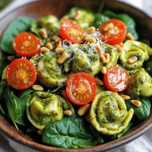 - 12 ounces cheese tortellini - 1 cup cherry tomatoes, halved - 1 cup baby spinach, roughly chopped - ½ cup creamy pesto (store-bought or homemade) - ¼ cup cream cheese, softened - 3 tablespoons extra virgin olive oil - 1 tablespoon fresh lemon juice - Salt and freshly cracked black pepper, to taste - ¼ cup pine nuts, toasted until golden - Grated Parmesan cheese, for garnish In this salad, the cheese tortellini is the star. It gives a nice bite and cheesy flavor. Cherry tomatoes add sweetness and color. Baby spinach brings a fresh, green crunch. Creamy pesto makes everything rich and flavorful. Cream cheese helps bind it all together. Olive oil and lemon juice add a bright finish. Toasted pine nuts give a delightful crunch. Lastly, a sprinkle of Parmesan cheese enhances the flavor. - Extra cherry tomato halves - A drizzle of olive oil - Fresh basil leaves These optional toppings can make your salad look even better. They add more color and flavor. Fresh basil gives a nice herb taste. You can also use more Parmesan if you love cheese. - Large pot for cooking tortellini - Mixing bowl - Whisk - Spatula or wooden spoon - Colander for draining tortellini - Serving dish These tools help you make the salad easily. A large pot lets you cook the tortellini right. A mixing bowl is perfect for combining the creamy pesto and cream cheese. A whisk helps mix everything smoothly. Use a spatula or wooden spoon to gently toss the salad. Finally, a colander drains the tortellini well, and a nice serving dish makes it look great. Start by boiling water in a large pot. Once it reaches a rolling boil, add 12 ounces of cheese tortellini. Cook them for 3-5 minutes until they are al dente. Once done, drain the tortellini in a colander. Rinse them under cold water to stop the cooking. Let them cool for a few minutes while you prepare the rest. In a large mixing bowl, take ½ cup of creamy pesto and ¼ cup of softened cream cheese. Use a whisk to mix them until smooth and creamy. This will be the base of your salad. Make sure there are no lumps. The creamy pesto will add great flavor to the dish. Now, it’s time to bring everything together. Add the cooled tortellini to the bowl with the creamy pesto. Then, toss in 1 cup of halved cherry tomatoes and 1 cup of roughly chopped baby spinach. Drizzle in 3 tablespoons of extra virgin olive oil and 1 tablespoon of fresh lemon juice. Use a spatula to mix gently. Make sure every piece is coated well. Taste your salad and add salt and freshly cracked black pepper to your liking. Finally, fold in ¼ cup of toasted pine nuts for a nice crunch. Transfer your salad to a serving dish and top it with grated Parmesan cheese. For the best taste, let it chill in the fridge for 30 minutes. Enjoy your creamy pesto tortellini salad! To cook tortellini just right, follow these steps: - Bring a large pot of salted water to a boil. - Add the tortellini and stir gently. - Cook for 3-5 minutes until al dente. - Drain the tortellini in a colander. - Rinse under cold water to stop cooking. This keeps the tortellini firm and tasty. To make this dish pop, try these tips: - Use fresh lemon juice for a bright taste. - Add a pinch of salt and cracked black pepper. - Toast the pine nuts for a richer flavor. - Let the salad rest in the fridge for 30 minutes. This helps all the flavors mix well together. Here are some great ways to serve your salad: - Use a clear bowl to show off the colors. - Top with extra cherry tomato halves for style. - Drizzle olive oil on top right before serving. - Pair with grilled chicken or crusty bread for a meal. These ideas will make your salad even more appealing. {{image_4}} You can use many types of pesto in this dish. Traditional basil pesto works well. You might also try sun-dried tomato pesto for a richer taste. Spinach pesto adds a fresh twist. For a nut-free option, use pumpkin seeds instead of pine nuts. Boost the salad's nutrition easily. You can add cooked chicken or turkey for extra protein. Chickpeas are great for a plant-based boost. Bell peppers add crunch and color. Avocado gives a creamy texture and healthy fats. Try adding some chopped nuts for extra crunch and flavor. For a gluten-free version, use gluten-free tortellini. They are widely available now. For a vegan salad, skip the cheese and use a vegan cream cheese. You can also use nutritional yeast for a cheesy flavor. Make sure your pesto is vegan, using ingredients like cashews and spinach. To keep your creamy pesto tortellini salad fresh, store it in an airtight container. Make sure it is sealed tightly. This helps to prevent the salad from drying out or absorbing other odors from the fridge. If you have extra cherry tomatoes or pine nuts, store those in separate containers. This keeps them fresh and prevents sogginess. When stored properly, creamy pesto tortellini salad can last in the fridge for about 3 to 5 days. Always check for any changes in smell or appearance before eating. If you notice anything off, it’s best to throw it out. The flavors may intensify over time, but the salad should still taste good within that timeframe. I do not recommend freezing creamy pesto tortellini salad. The texture of the tortellini and greens can change when thawed. However, if you want to freeze it, do so without the fresh ingredients like spinach and tomatoes. The creamy pesto sauce can freeze well. When you’re ready to use it, thaw it in the fridge overnight and mix it with fresh ingredients before serving. Yes, you can use store-bought pesto. It saves time and effort. Look for a high-quality brand. A good pesto should taste fresh and vibrant. Always check the ingredients for the best flavor. Making homemade pesto is easy. You need fresh basil, garlic, pine nuts, olive oil, and Parmesan cheese. 1. Blend 2 cups of fresh basil leaves with 2 cloves of garlic. 2. Add ¼ cup of pine nuts and ½ cup of grated Parmesan. 3. Slowly drizzle in ½ cup of olive oil while blending. 4. Season with salt and pepper to taste. This will give you a fresh and flavorful pesto. Creamy Pesto Tortellini Salad pairs well with many dishes. Try serving it with grilled chicken or shrimp for protein. A side of garlic bread or a fresh green salad complements it nicely too. You can also enjoy it as a light meal on its own. Yes, this salad is great for meal prep. It keeps well in the fridge for a few days. Just store it in an airtight container. To keep it fresh, add the pine nuts just before serving. This way, they stay crunchy and tasty. This blog post covered how to make a tasty creamy pesto tortellini salad. We explored the key ingredients and optional toppings, along with helpful kitchen tools. I provided step-by-step instructions for cooking the tortellini and mixing the creamy pesto. You learned tips for perfect texture and flavor, plus variations to fit your needs. Finally, we discussed storage and answered common questions. Now, you have everything you need to create this delightful dish at home! Enjoy your cooking adventure and savor every bite of your salad!