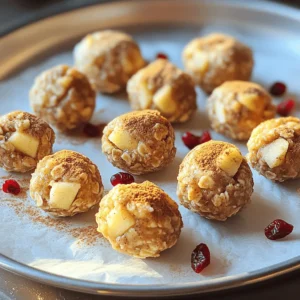 - 1 cup rolled oats - 1/2 cup almond butter (or any nut butter of your choice) - 1/4 cup honey or maple syrup - 1 small apple, peeled and finely chopped - 1 teaspoon ground cinnamon - 1/2 teaspoon ground nutmeg - 1/4 cup chopped walnuts or pecans - 1/4 cup raisins or dried cranberries - A pinch of salt The main ingredients make these bites tasty and healthy. The rolled oats give a nice base. The almond butter adds creaminess and protein. Honey or maple syrup sweetens the mix naturally. The fresh apple gives a juicy crunch, while the spices create that warm, cozy flavor. Nuts add healthy fats, and dried fruits offer extra sweetness. A bit of salt balances everything. - Additional toppings (e.g., chopped nuts or shredded coconut) - Suggested flavor enhancers You can add toppings to make these bites even better. Try rolling them in chopped nuts or shredded coconut for a fun twist. If you like more flavor, consider adding a dash of vanilla extract or a sprinkle of cocoa powder. These options let you customize your bites to your taste. Feel free to experiment! Start by taking a large mixing bowl. Add 1 cup of rolled oats, 1/2 cup of almond butter, and 1/4 cup of honey. You can also use maple syrup if you prefer. Mix the ingredients well with a spatula or spoon. Keep mixing until you get a sticky dough. It should hold together nicely without falling apart. Next, you want to add some flavor and texture. Stir in 1 small peeled apple that you’ve finely chopped. Then add 1 teaspoon of ground cinnamon and 1/2 teaspoon of ground nutmeg for that warm, cozy taste. Toss in 1/4 cup of chopped walnuts or pecans, and 1/4 cup of raisins or dried cranberries. Don’t forget a pinch of salt! Mix everything until it's evenly spread throughout the dough. Now it's time to shape your bites. Use clean hands to grab small amounts of the mixture. Aim for about 1 tablespoon each. Roll these portions into balls that are about 1 inch wide. Make sure they are similar in size so they look nice and cook evenly. After rolling the bites, it’s important to chill them. Place the energy bites on a baking tray lined with parchment paper. This will stop them from sticking. Put the tray in the fridge for at least 30 minutes. Chilling helps the bites firm up, making them easier to eat later. To make the best Apple Pie Energy Bites, focus on the mixture. You want it sticky, not dry. If it feels crumbly, add a bit more almond butter or honey. If it is too wet, add a little more oats. This balance keeps your bites together. You can also adjust sweetness. Use more honey or maple syrup if you like it sweeter. If you prefer less sweetness, cut back a little. If you have nut allergies, use sunflower seed butter instead of almond butter. This swap keeps the flavor while keeping it safe. For a vegan version, replace honey with maple syrup. Both choices work great and keep your snacks healthy! To make your bites even tastier, try adding spices. A dash of ginger or allspice can add warmth. You can also mix in more fruits. Consider adding dried apples or chopped dates for extra sweetness. If you like a crunch, toss in some seeds or coconut flakes. These additions make each bite unique and fun! {{image_4}} You can change the fruit in your energy bites. Instead of apples, try pears. They add a juicy taste and soft texture. Dried apples work well too. They give a sweet flavor and chewy bite. You can also mix in berries for a different twist. Blueberries or cranberries add color and fun flavors. If you need a nut-free snack, use sunflower seed butter or tahini. Both options keep the bites creamy and rich. Sunflower butter gives a slightly nutty taste without the nuts. Tahini adds a unique flavor and pairs well with the spices. These swaps let everyone enjoy the bites safely. For those who love chocolate, add chocolate chips or cocoa powder. Mixing in dark chocolate chips makes the bites extra special. Cocoa powder adds a deep chocolate flavor without extra sweetness. You can adjust the amount based on how chocolatey you want them. This variation makes a great treat for chocolate fans while keeping it healthy. To keep your Apple Pie Energy Bites fresh, store them in an airtight container. This helps prevent them from drying out. You can use glass jars or plastic containers. Just make sure they seal well. Keep them in the fridge for the best taste and texture. In the fridge, these bites last up to one week. After that, they may lose flavor and texture. If you want to keep them longer, freezing is a great option. Place the bites in a single layer on a baking tray. Freeze them for about an hour. Once firm, transfer them to a freezer-safe bag or container. They can last for up to three months in the freezer. When you want to eat them, just thaw in the fridge overnight. Enjoy the same great taste anytime! To make these energy bites vegan, you can swap honey for maple syrup. Use nut butter that is marked vegan. Rolled oats are already vegan, so no change is needed there. These simple swaps create a tasty vegan treat. You can use quick oats, but your bites might be softer. Rolled oats give a chewier texture. Quick oats blend more into the mix. Choose based on your texture preference. You can use peanut butter, cashew butter, or sunflower seed butter. Each nut butter has its unique flavor. Peanut butter adds a classic taste, while sunflower seed butter is great for allergies. These bites can last up to one week in the fridge. Store them in an airtight container to keep them fresh. Signs of spoilage include an off smell or change in texture. We explored how to make delicious Apple Pie Energy Bites using simple ingredients. You learned how to mix oats, nut butter, and spices. I shared tips for perfecting your bites and even suggested variations. Remember, you can easily adjust flavors and ingredients to suit your taste. Enjoy making these snacks that are yummy and good for you. With the right storage, they will stay fresh for longer. Try different combinations and find what you love best!
